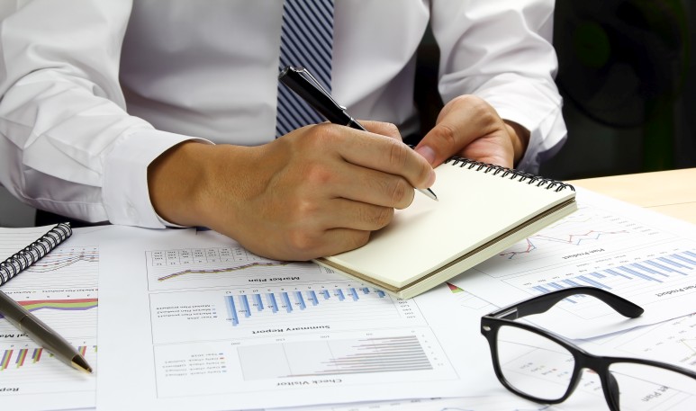 Businessman making decisions using sales data