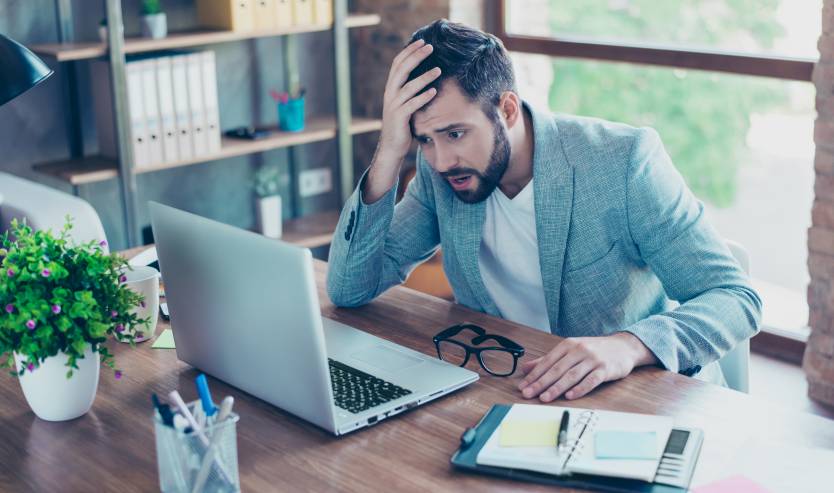 Businessman confused by his computer